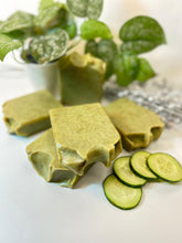 Load image into Gallery viewer, Cucumber Aloe Vera Soap have many benefits for your skin, including:&nbsp;

Hydration: Aloe vera is known for its hydrating properties, and cucumber are high in water content. Together, they can help keep your skin hydrated and healthy.&nbsp;

Skin Tone: Cucumber contains vitamins A, C, and E, which can help lighten your skin tone.

Antibacterial: Aloe vera contains saponins, which have a natural cleansing and antiseptic effect. This can help kill bacteria that cause breakouts and prevent infection of irrit
